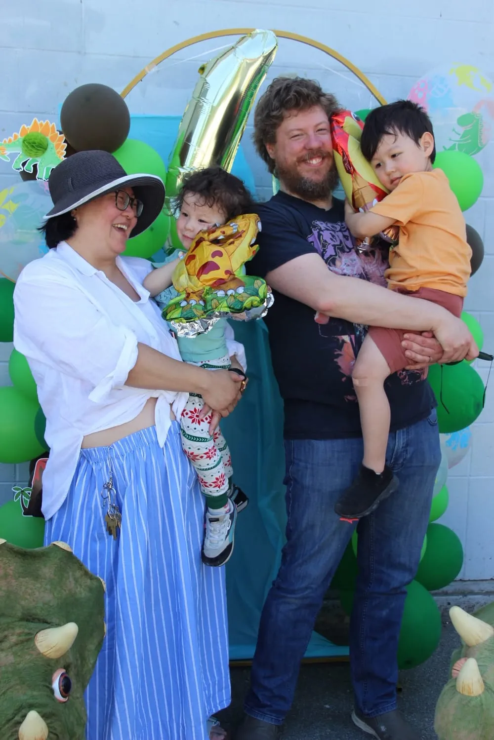 Ezra's family at his dinosaur-themed 4th birthday party