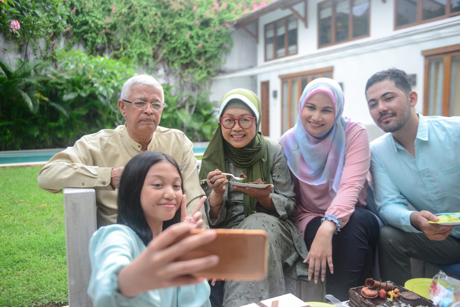 Multi-generational family taking a selfie together